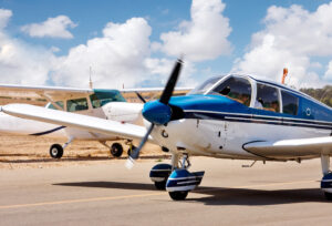 small propellor plane on runway 